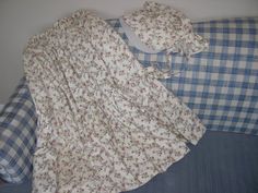 a blue and white checkered pillow on a bed