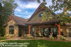 a large house with stone and wood accents