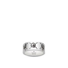 Gucci lets you have Halloween fun all year long with this ring from the Gucci Ghost collection. With a lustrous rhodium plating, this sterling silver band is inscribed with a skull with Gucci's double G hallmark as eyes, and more dripping double G's with stitched X's glamorize this ring as well. There is an unforgettable glow to this Gucci ring. Gucci Skull Ring, Gucci Silver Ring With Polished Finish, Gucci White Gold Sterling Silver Ring, Gucci Sterling Silver Ring, Gucci Silver Sterling Silver Rings, Gucci Adjustable Jewelry As Gift, Gucci Ghost Ring, Ghost Collection, Ghost Ring