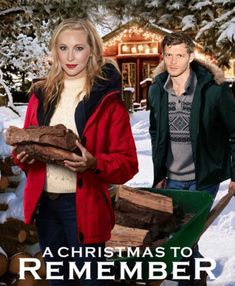 a christmas to remember poster with two people in front of a log pile and the words, a christmas to remember