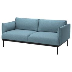 a blue couch sitting on top of a white floor next to a black metal frame