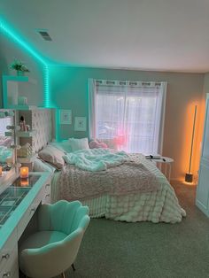 a bed room with a neatly made bed sitting next to a desk and two chairs