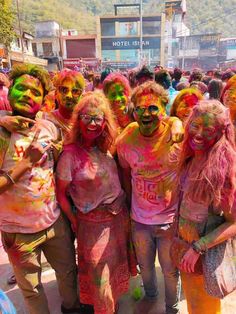 a group of people covered in colored paint