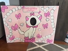 a pink birthday card with an image of a cat