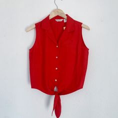 Chic Sleeveless Button Down Shirt That Features A Collar And Tie Front. Lightweight Material With A Sturdiness To Keep Shape. Made Of 100% Silk. More Of A Burnt Red Color, Very Flattering. Small Palm Tree Emblem On Left Breast. Size 14 New With Tags! Red Button-up Tops For The Beach, Red Sleeveless Vest With Buttons, Red Sleeveless Top With Button Closure, Small Palm Trees, Sleeveless Button Down Shirt, Cropped Button Down, Dress Book, Burnt Red, Stylish Dress Book