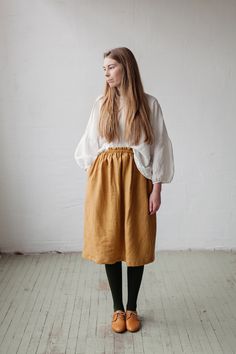 Below the knee skirt is made from 100% soft and washed linen. This Petticoat is perfect for wearing under dress or other skirt or can be worn alone. Match it with our tunics! Details: - Composition: 100% Oeko-Tex certified linen - Colour: mustard yellow - Elastic waist - Pockets - Size: One size/fits all - Medium weight linen - Linen care: machine wash gentle; tumble dry low, ironing optional - The price is for one skirt, other pictured items are not included Relaxed Fit Midi Skirt For Daywear, Relaxed Fit Gathered Midi Skirt, Relaxed Fit Long Skirt For Daywear, Relaxed Fit Flared Skirt For Fall, Fall Season Relaxed Fit Flared Skirt, Relaxed Fit Long Gathered Skirt, Long Gathered Skirt With Relaxed Fit, Fall Flared Skirt For Daywear, Relaxed Fit Pleated Skirt