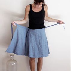 This sewing pattern is for a basic wrap skirt. On one side it closes invisible with a button, on the other side it has two straps.\n\nThe pattern is for the sizes XSmall to XLarge, which have waist measurements of between 65 cm and 90 cm / 25.5 and 35.5 inch Wrap Skirt Pattern, Linen Wrap Skirt, Long Linen Skirt, Skirt Asymmetrical, Skirt Linen, Mid Calf Skirt, Tailored Clothes, Handmade Skirts, Grey Skirt