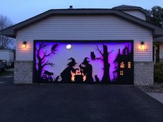 a garage with a halloween scene painted on it