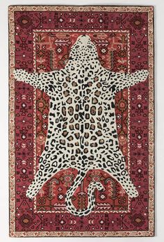 an animal print rug hanging on the wall