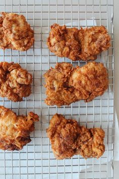 six fried food items on a cooling rack