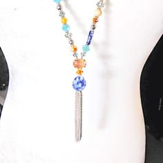 New*Hand Crafted*Y Style Necklace W/Chain Tassel. Gray & Silver Color Chain Tassel & Neck Chain. 16mm Teardrop Genuine Sodalite Stone Focal Point. Various Sizes & Shapes Of Genuine Sodalite. Various Colors & Sizes Of Czech Faceted Glass Beads. 32"Long/Oal 36"/Tassel 2.875". Trendy Bohemian/Shabby Chic Styles. Hand Crafted By Sharon. Smoke Free Home. Adjustable Blue Lariat Necklace For Festivals, Bohemian Silver Long Necklace With Colorful Beads, Bohemian Silver Long Necklace With Round Beads, Silver Bohemian Long Necklace With Round Beads, Bohemian Blue Long Necklace With Colorful Beads, Blue Bohemian Long Necklace With Colorful Beads, Bohemian Long Blue Necklace With Colorful Beads, Handmade Blue Lariat Long Necklace, Blue Beaded Chain Lariat Necklace