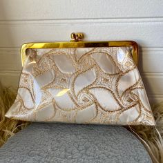 "Gold embroidered off-white satin covered with clear vinyl purse. Super sweet little clutch! Height 5\" Width 8\" Depth 2\" Please note that I don't accept returns if the item doesn't fit, unless I've made a huge mistake in the measurements or description. Please make sure to read the description and check the measurements carefully against a similar item that fits you well!" Vintage White Clutch For Party, Cream Pouch Clutch For Evening, Vintage White Pouch Evening Bag, Cream Clutch Evening Bag For Formal Events, Cream Clutch Evening Bag For Formal Occasions, Cream Pouch Clutch For Event, Cream Pouch Clutch For Events, Embroidered Cream Rectangular Clutch, Cream Rectangular Coin Purse