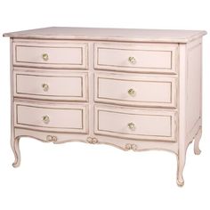 a white dresser with many drawers and knobs on the top drawer is shown in front of a white background