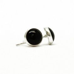 These 6mm black onyx stud earrings are sure to become fast favorites.  Simply perfect for everyday wear!   They feature a single 6mm black onyx cabochon.  Onyx, a type of opaque chalcedony, occurs naturally in black. Completely handmade in my studio using all sterling silver.  I have hand soldered the bezels to the studs and mounted the stones within them.  The posts are sterling silver.  • 6mm Black Onyx • 925 Sterling Silver or 14/20 Yellow Gold Fill• Artisan Made They will arrive carefully pa Minimalist Black Sterling Silver Earrings, Nickel-free Black Everyday Jewelry, Minimalist Nickel-free Black Jewelry, Black Hypoallergenic Adjustable Earrings, Minimalist Black Plug Earrings For Gift, Black Hypoallergenic Sterling Silver Earrings, Black Sterling Silver Plug Earrings As Gift, Nickel-free Black Plug Earrings As Gift, Everyday Black Sterling Silver Earrings