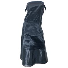 Chic minimalist at its best! This 1990s JIL SANDER strapless dress is so much more than a classic little black dress. You will find yourself wondering if you are wearing a black or gunmetal dress. Beautiful metallic 'wet look' fabric gives off the perfect sheen. Adjustable straps at each side of the bodice to ensure proper fit. Hidden zipper up the back with hook-and-eye closure. A very flattering fit that can easily transition from day to evening, and is perfect for layering. In great unworn co Jil Sander 90s, Silk Charmeuse Dress, Chic Minimalista, Classic Little Black Dress, 1990s Dress, Flapper Style Dresses, Sleeveless Wrap Dress, Cocktail Dress Vintage, Flapper Style