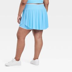 Why we're ALL IN: Solid-color seamless skort with soft gathers and wrap-style accents on the sides. Boasts a midweight nylon and spandex construction with four-way stretch as well as moisture-wicking properties to help keep you cool and comfy during any activity. The wide waistband with drawcord, built-in brief, mini length and mid-rise waist complete the sporty design. All in Motion™: Inspiring the potential in every body. Sporty Stretch Blue Swim Skirt, Blue Stretch Swim Skirt For Sports, Blue Swim Skirt For Sports, Blue Sports Skort With Elastic Waistband, Blue Sports Swim Skirt, Sporty Blue Tennis Skirt With Elastic Waistband, Blue 4-way Stretch Athleisure Skort, Blue 4-way Stretch Sporty Skort, Sporty Blue Swim Skirt With 4-way Stretch