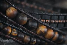 "Mens leather wrap bracelet with fantastic matte Tiger Eye, tiny faceted Hematite. Wrap is woven on genuine leather cord and finished with a small metal button. Wraps around an average man's wrist three times. ⇒ GEMSTONE MEANINGS ♡ Tiger's Eye is a stone of protection that is also very stabilizing and grounding. It enhances integrity, willpower, self-confidence, practicality and correct use of power. It is a stone that enhances good luck, and brings prosperity, often in the form of money. Tiger'