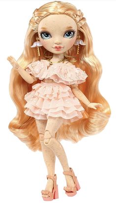 a doll with long blonde hair and blue eyes wearing a pink frocked dress