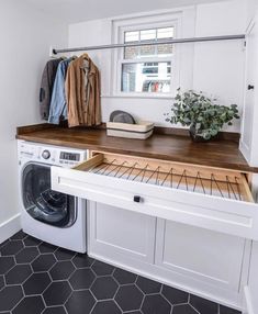 a washer and dryer in a small room