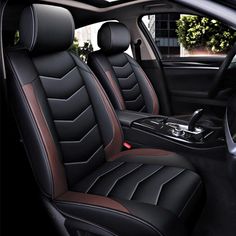 the interior of a car with black and brown leather seats