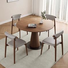 a round table with four chairs around it