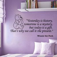 a purple bedroom with a teddy bear wall decal on the wall and a quote from winnie the pooh