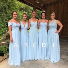 the bridesmaids are posing in their blue dresses