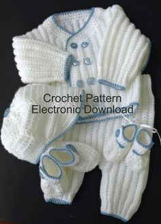 a crochet sweater and booties are shown in white with blue trims