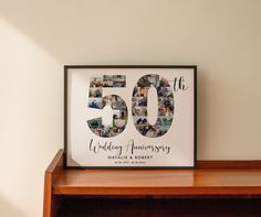 a wooden shelf with a framed 50th anniversary photo on it and the words, 50 th wedding anniversary