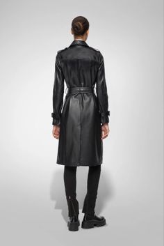 Women's Trench Leather Coat In Black With Belted Waist Step into elegance with our women's trench leather coat in black. This exquisite coat is crafted from semi-aniline cowhide leather, offering both luxury and durability. The classic turn-down collar, belted waist, and button closure provide a sophisticated silhouette, while open hem cuffs with straps add a refined touch. Complete with one inside pocket and two side pockets, this trench coat is the epitome of chic functionality, perfect for any occasion. Outer Shell: Genuine Leather Leather Type: Cowhide Leather Finish: Semi-aniline Feature: Belted Waist Closure Style: Button Collar Style: Turn Down Cuffs Style: Open Hem With Straps Inside Pockets: One Outside Pockets: Two Side Pocket Color: Black Designer Leather Jacket With Belt, Luxury Leather Jacket With Belt, Luxury Leather Belted Leather Jacket, Designer Belted Leather Jacket, Luxury Leather Belted Jacket, Luxury Black Leather Jacket, Elegant Black Leather Outerwear, Belted Leather Jacket For Office, Office Leather Belted Jacket