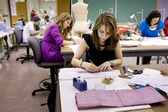 two women working on crafts in an art class