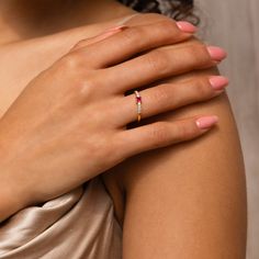 a woman's hand with a ring on it