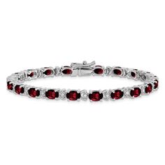 Rhodium over 14k white gold 12 cttw oval garnet and 0.1 cttw diamond bracelet. Measures approximately 3/16 of an inch in width and has a box catch closure. Garnet Birthstone, Dainty Bracelet, White Gold Bracelet, Wedding Jewelry Bracelets, Red Gemstones, Diamond Chain, Garnet Stone, Birthstone Bracelets, Dainty Bracelets