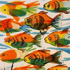 a group of fish swimming in the ocean next to each other on a sheet of paper