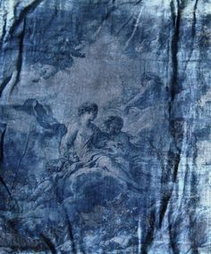 an image of a painting on a piece of cloth that looks like it has been dyed blue