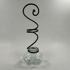 a glass vase with a spiral design in it