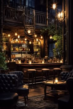 a dimly lit bar with leather chairs and tables in front of an ornate staircase leading up to the second floor