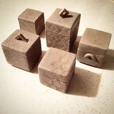 five cement blocks sitting on top of a table