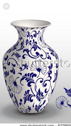 a blue and white vase sitting on top of a table