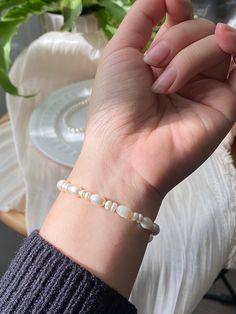 Adorn your wrist with the timeless elegance of our Freshwater Pearl Stretch Bracelet. Each pearl is hand-selected for its lustrous sheen, creating a graceful symphony of light with every movement. Designed for comfort and versatility, this bracelet stretches to fit any wrist, making it the perfect gift for anyone appreciating classic beauty. Whether it's a casual brunch or a formal gathering, this piece is your companion for every moment, adding a touch of sophistication to your ensemble. Indulg Personalized Bracelets, Classic Beauty, Stretch Bracelet, Stretch Bracelets, Gift For Him, Fresh Water, Freshwater Pearls, Gifts For Him, Gold Filled