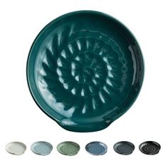 a green bowl with six different designs on the side and four smaller bowls below it