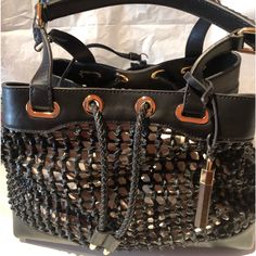 Nwt Gorgeous Vince Camuto Signature Couture Black Woven Leather Handbag With Woven Pull Cord Closure. Gold Tone Hardware. Two Braided Detail Handles. Four Feet At Bottom. Detachable Black Zippered Pouch. Detachable Gold And Wood Vc Handbag Charm. Can Be Used As Is Or With A Colorful Handbag Organizer Or Scarf Inside The Bag. Includes Vc Signature Dust Bag. 10% Discount On Bundle Of Three Or More Itemsp Luxury Black Tote Satchel, Evening Bucket Satchel With Handles, Evening Bucket Satchel, Black Rectangular Satchel With Dust Bag Included, Black Rectangular Satchel With Dust Bag, Designer Black Satchel With Leather Handles, Luxury Black Tote Shoulder Bag, Designer Black Bag With Handles, Designer Black Bags With Handles