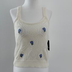 Size M. Knitted Crop Top With Cute Embroidered Baby Blue Flowers. Ivory Color. New With Tags. Material: 55% Cotton. 45% Acrylic Off White Cotton Sweater For Spring, Casual Embroidered Crochet Top, Cream Pointelle Knit Cotton Top, Cream Knit Sweater With Floral Embroidery, Cream Cotton Pointelle Knit Top, Cream Knitted Cotton Tops, Cream Cotton Knitted Tops, Cream Knit Tops For Spring, Spring White Knit Top