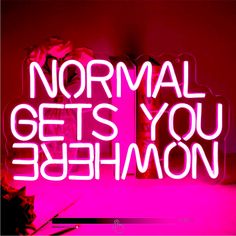 a neon sign with the words normal gets you behemon written on it in front of a pink background