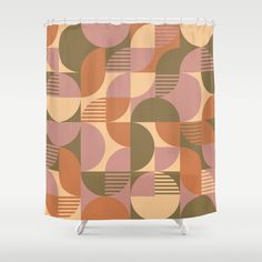 a shower curtain with an abstract design in brown, pink and orange colors on it