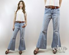 Vintage nineties LIGHT DENIM BELL BOTTOMS. Super FLARED legs. 100% cotton. Perfect FESTIVAL jeans!  Model is 5'9. Her measurements are: bust=34 inches, waist=26 inches, & hips=34 inches. The dress fits as shown on her. We measure on a flat surface from seam to seam. Bust, waist, & hip measurements have already been doubled. We suggest you compare our measurements to a garment you already own and know fits you well to ensure a proper fit. label: laura c. jeans approximate size: M vintage size on tag: 7 material: 100% cotton waist: 28 inches  hips: 36 inches length: 40.75 inches rise: 11 inches VERY IMPORTANT WE DO NOT TAKE RETURNS FOR ITEMS THAT DO NOT FIT. We take extreme care to measure each item accurately, so please take note of the measurements. We recommend that you compare the measur Hippy Jeans, 1970s Style Medium Wash Denim Bottoms, 1970s Style Full Length Denim Bottoms, Bohemian Full-length Denim Bottoms, Medium Wash Full-length Recycled Denim Flare Jeans, Hippie Jeans, 1970s Full-length Denim Jeans, Boho Jeans, 90s Jeans