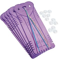 purple plastic hangers with pins and wires attached to them, on a white background