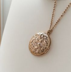 Introducing our exquisite Sterling Silver Picture Locket Necklace! This meticulously crafted pendant measures a delightful 16X20mm, making it the perfect size to hold your cherished memories close to your heart. Made from highest quality sterling silver, this locket necklace is a timeless piece that exudes elegance and sophistication. Whether you decide to keep a picture of a loved one or a precious memento inside, this necklace is a heartfelt and timeless gift for yourself or a special someone. Upgrade your jewelry collection with this stunning sterling silver picture locket necklace and carry your cherished moments with you wherever you go. Luxury Vintage Necklace For Keepsake, Vintage Locket Charm Necklace For Mother's Day, Vintage Rose Gold Locket Necklace For Gift, Vintage Rose Gold Locket Necklace Gift, Elegant Handmade Antique Gold Locket Necklace, Vintage Charm Jewelry With Flower Pendant For Gift, Vintage Flower Pendant Charm Necklaces As Gift, Rose Gold Locket Necklace With Charms For Gift, Vintage Flower Pendant Jewelry As Gift