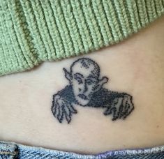 a person with a tattoo on their stomach