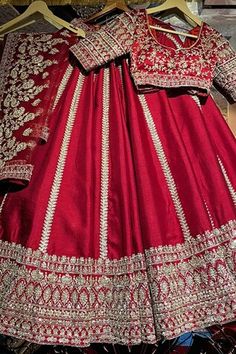 Red attached cancan flared lehenga with panelled embroidery using mix material of dabka dori, sitara sequins, zari, beads and pearls in floral motifs. Paired with a padded blouse with embroidery using similar work and a belt with coordinating mobile packet. Comes along with a veil dupatta with embroidered and kiran lace border and a second dupatta with dabka, sitara embroidery. - Aza Fashions Red Choli For Traditional Ceremonies, Red Fitted Lehenga For Traditional Ceremonies, Red Dori Work Dress For Traditional Ceremonies, Red Dress With Dori Work For Traditional Ceremonies, Veil Dupatta, Flared Lehenga, Padded Blouse, Bridal Lehengas, Lace Border